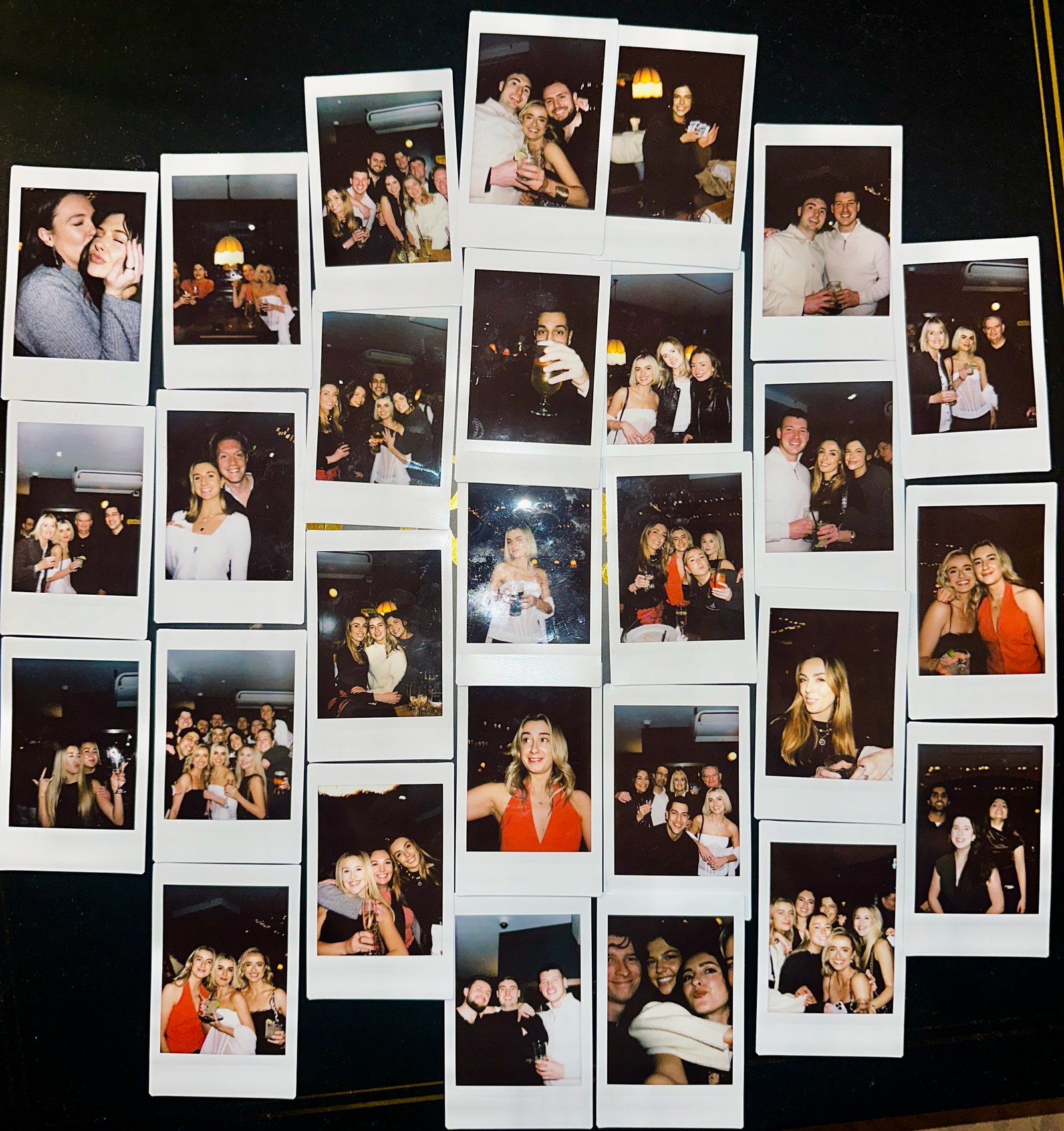 A wall of polaroids with friends